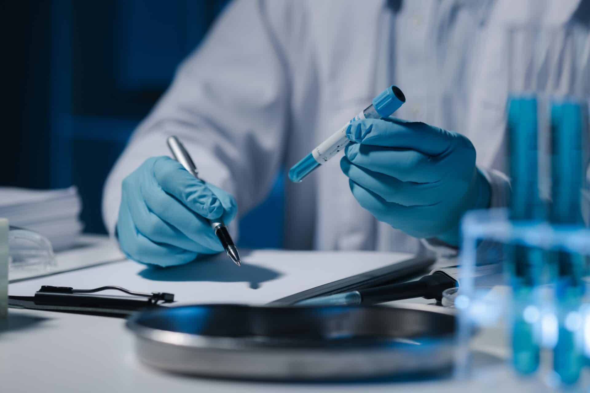 Pharmaceutical researcher analyzing test samples for drug development.